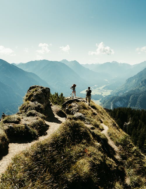 People Hiking in Mountains