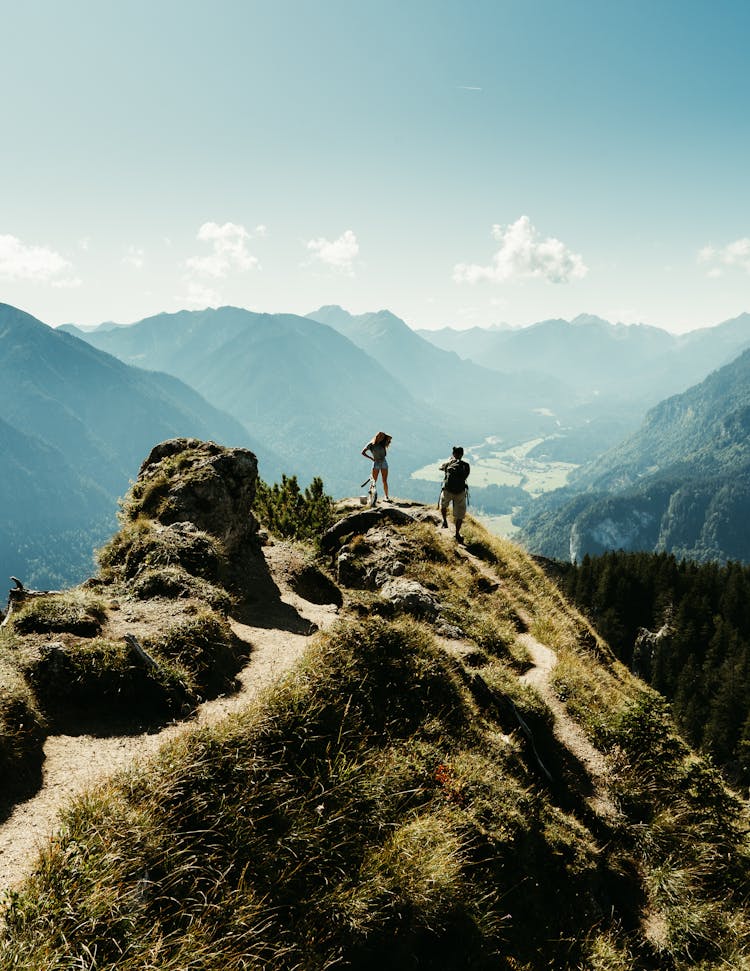 People Hiking In Mountains