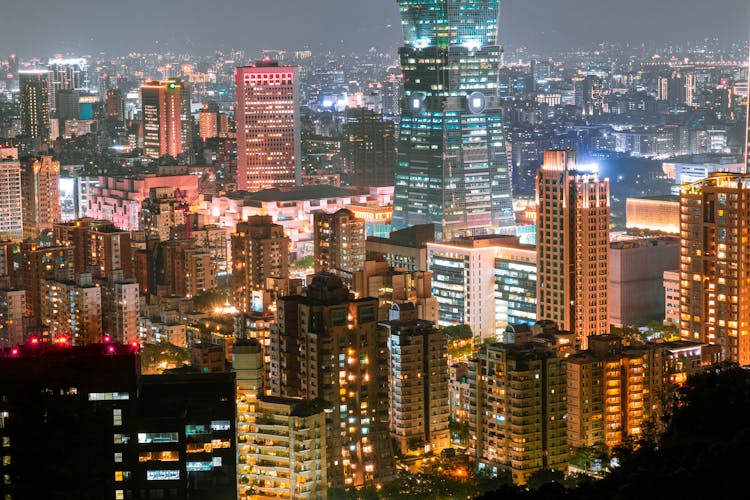 Illuminated Buildings In City At Night