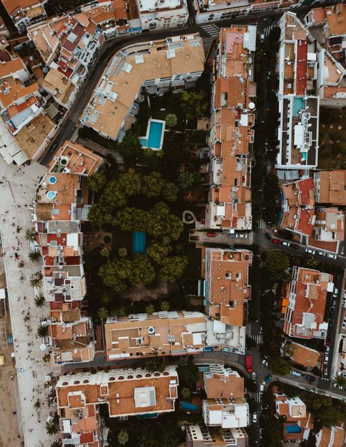 Free Stunning aerial view of urban architecture in Sitges, showcasing traditional Mediterranean style and greenery. Stock Photo