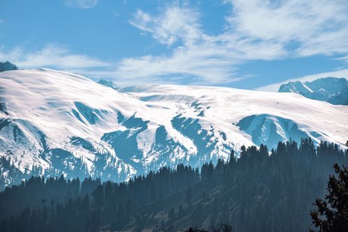Free Stunning view of snow-covered mountains and forest in Gulmarg. Stock Photo