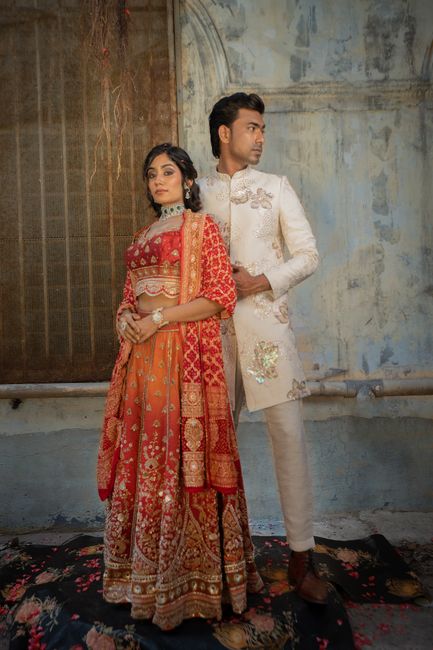 A couple elegantly dressed in traditional Indian garments, showcasing cultural fashion and romance.