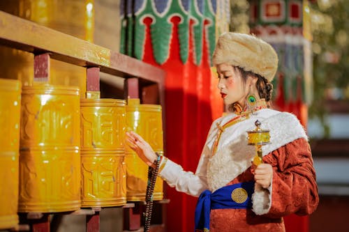 Woman by Prayer Wheels