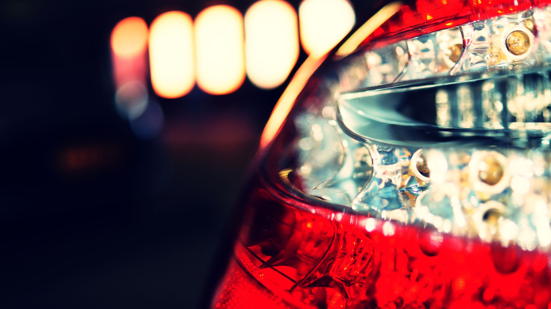 Close-up of a car tail light highlighting bokeh and macro photography elements.