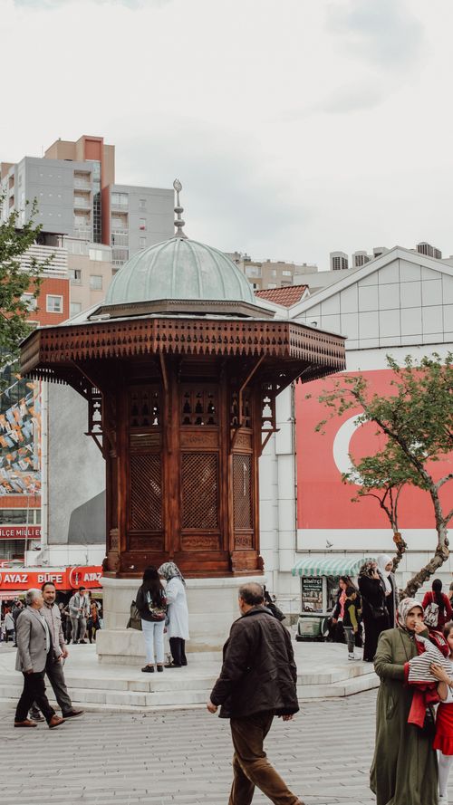 Free Bustling old town square in Sarajevo with historical architecture and pedestrians. Stock Photo