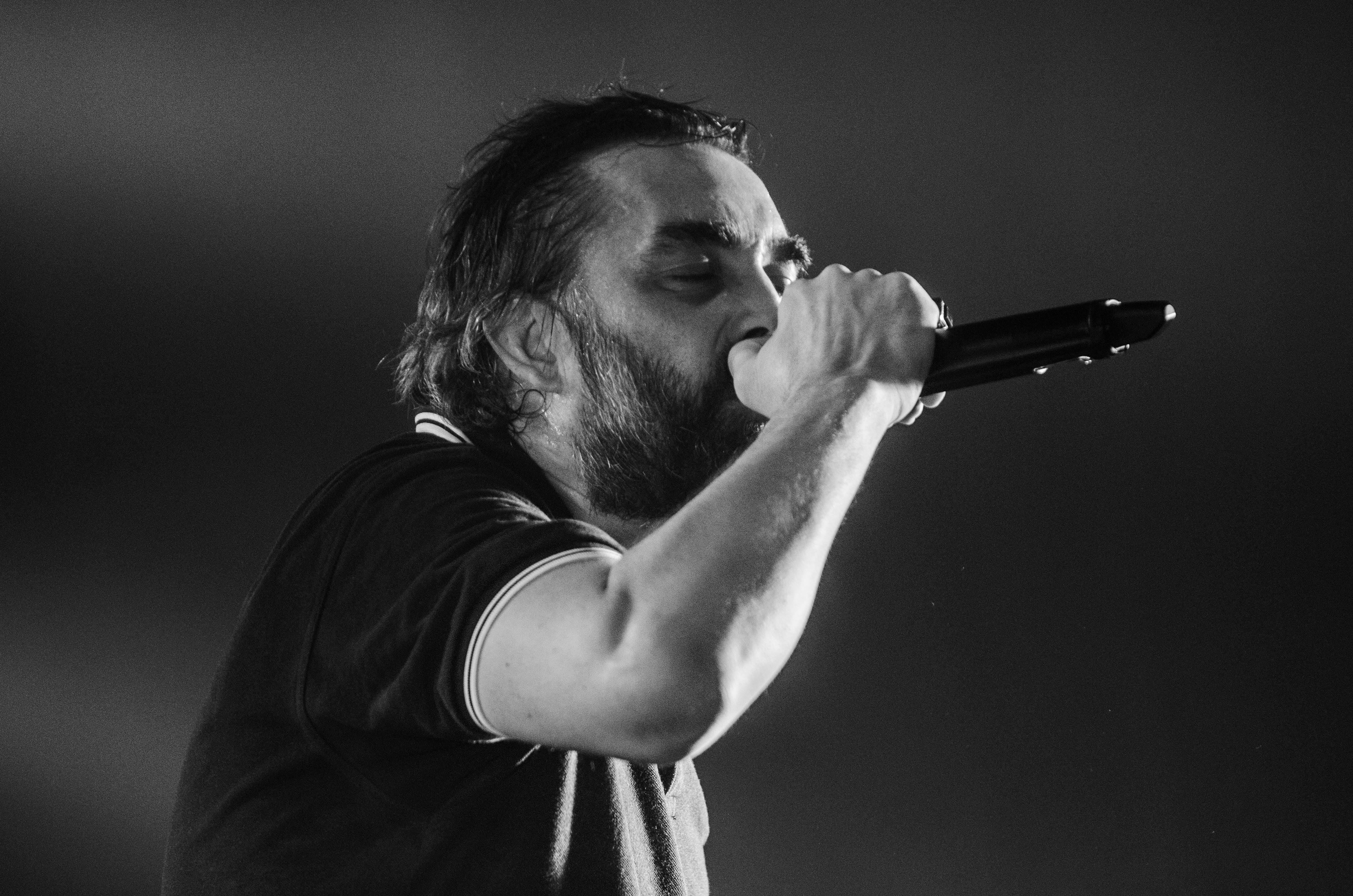 Monochrome Photo of Man Singing · Free Stock Photo