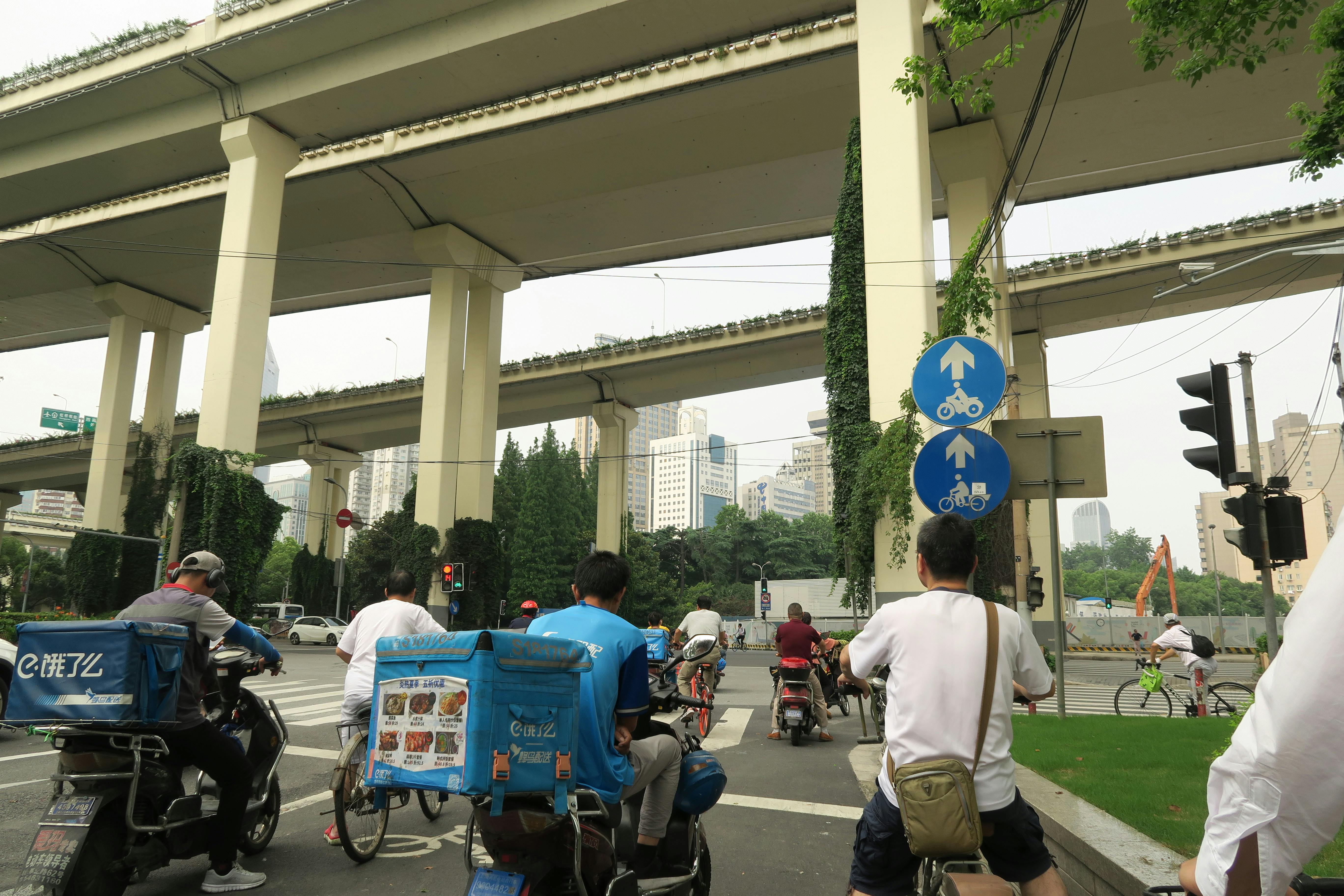 Pop singer performing under red and purple stage lights with dramatic pose
