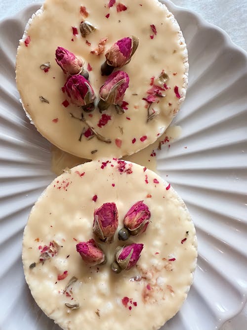 Free Rice Cakes with White Chocolate and Dried Roses on Top  Stock Photo