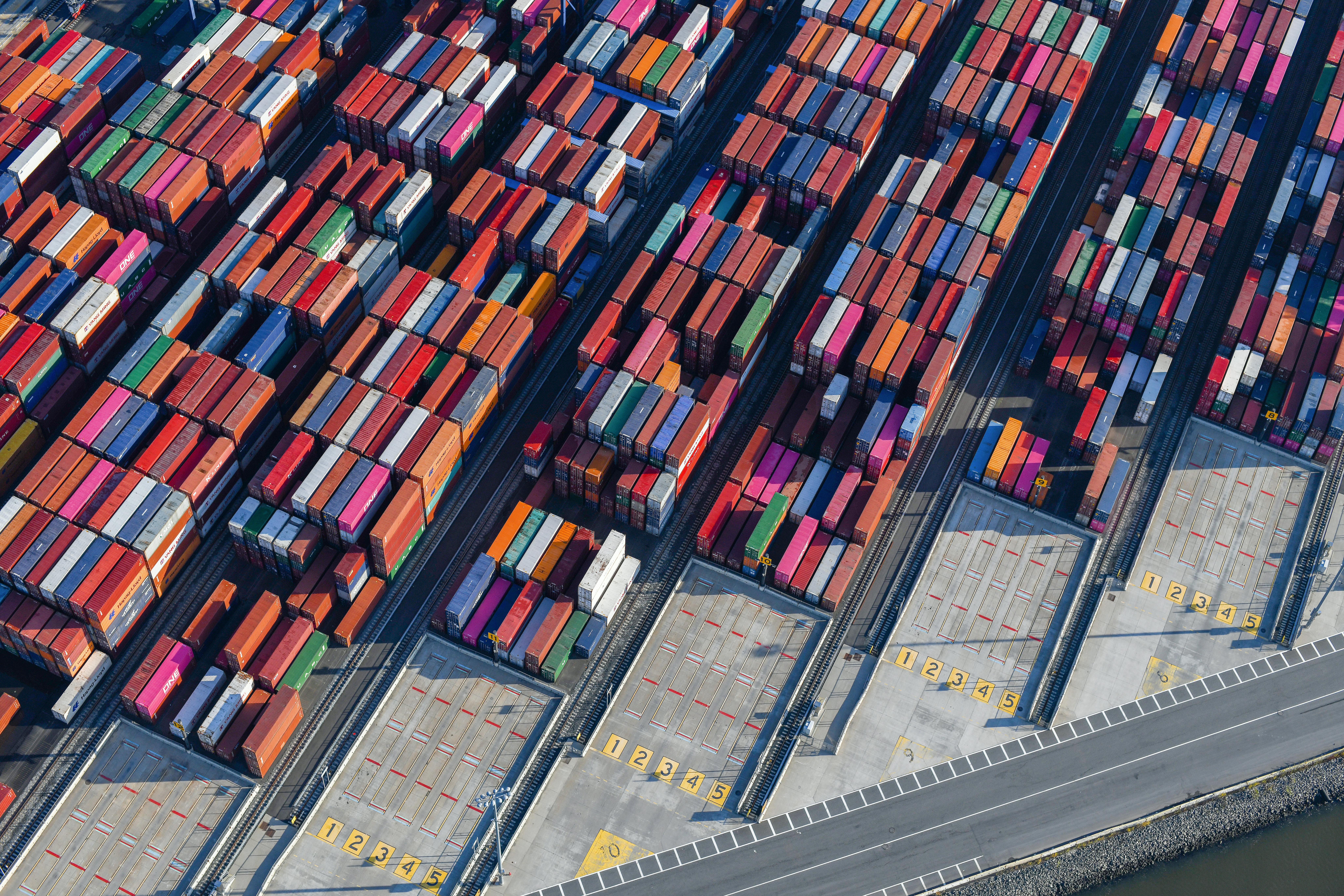 Shipping containers in a busy port - tariffs on china