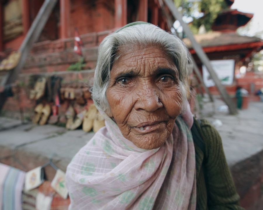 Close documentary portrait of an elderly woman