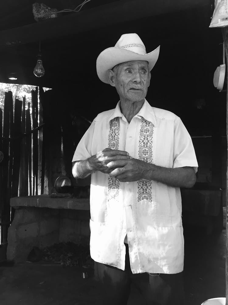 Elderly Man In Hat And Shirt