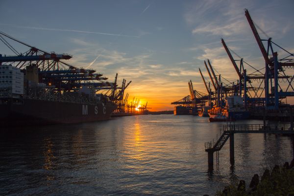 Port cranes at sunset