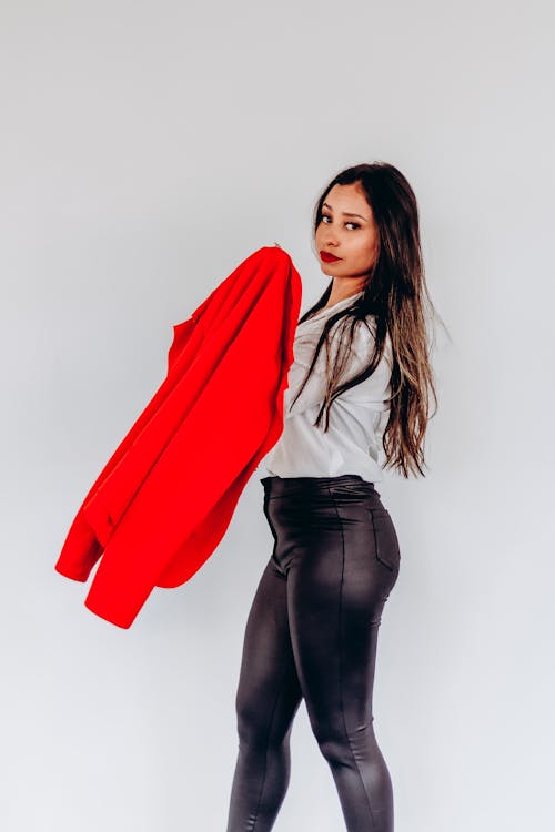 Brunette Woman Posing with Red Suit