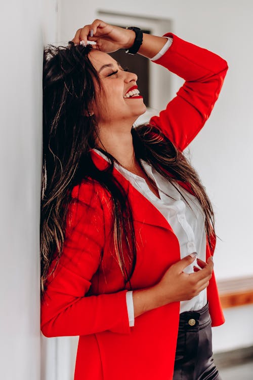 Smiling Brunette Woman in Red Suit