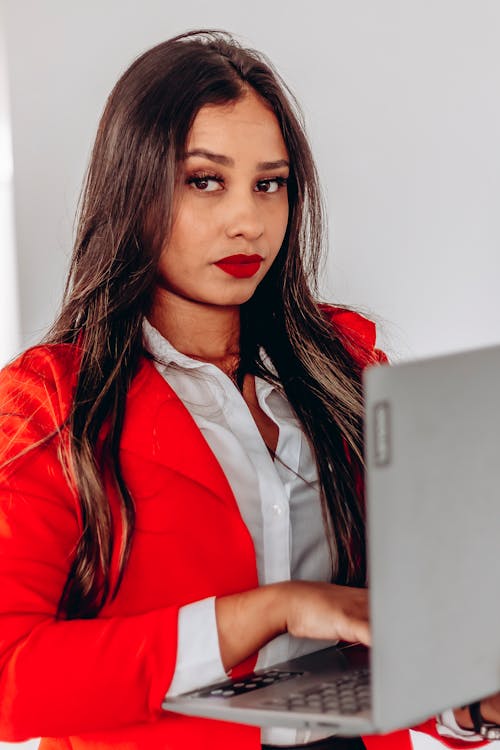 A Young Woman Working on a Laptop