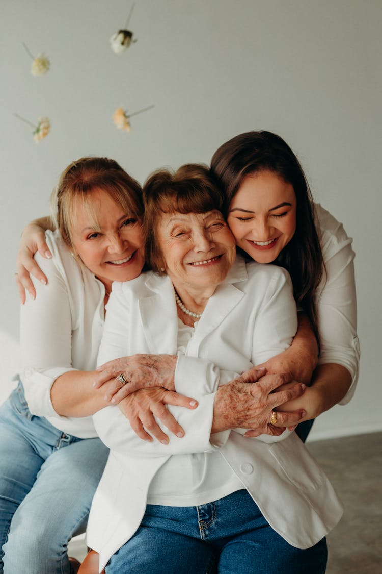 Mother And Daughter Hugging Grandma