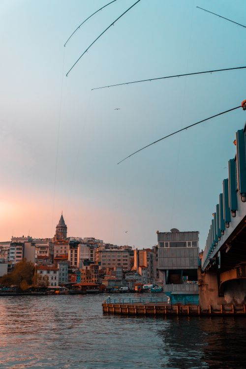 Free Stunning view of Galata Tower and nearby bridge in Istanbul during sunset, capturing city skyline charm. Stock Photo