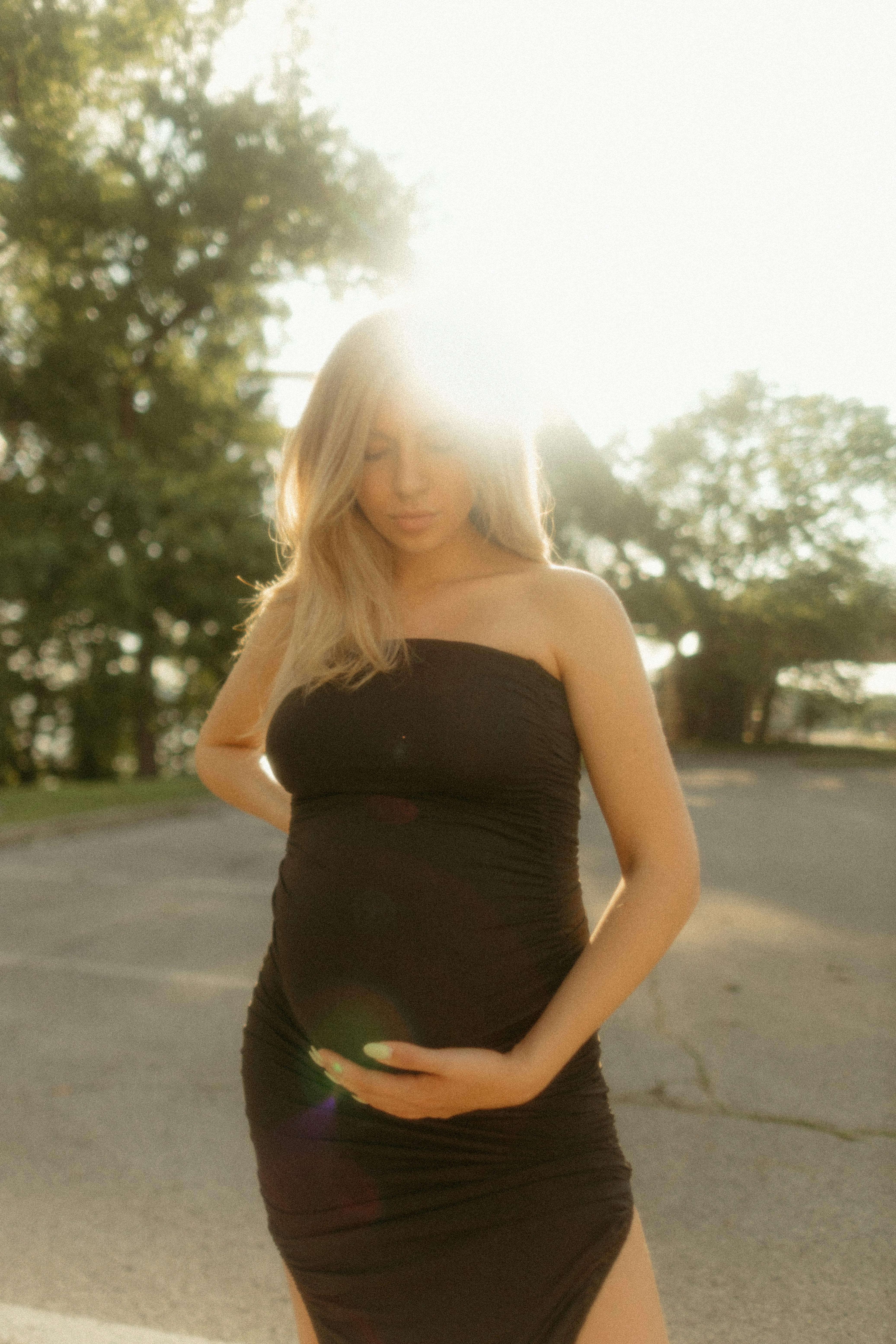 Sunlight over Pregnant, Blonde Woman Posing · Free Stock Photo