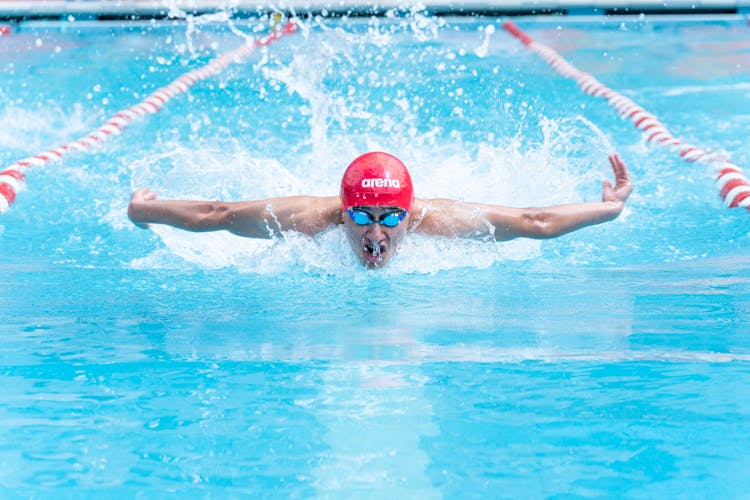 Man Swimming In A Swimming Pool 