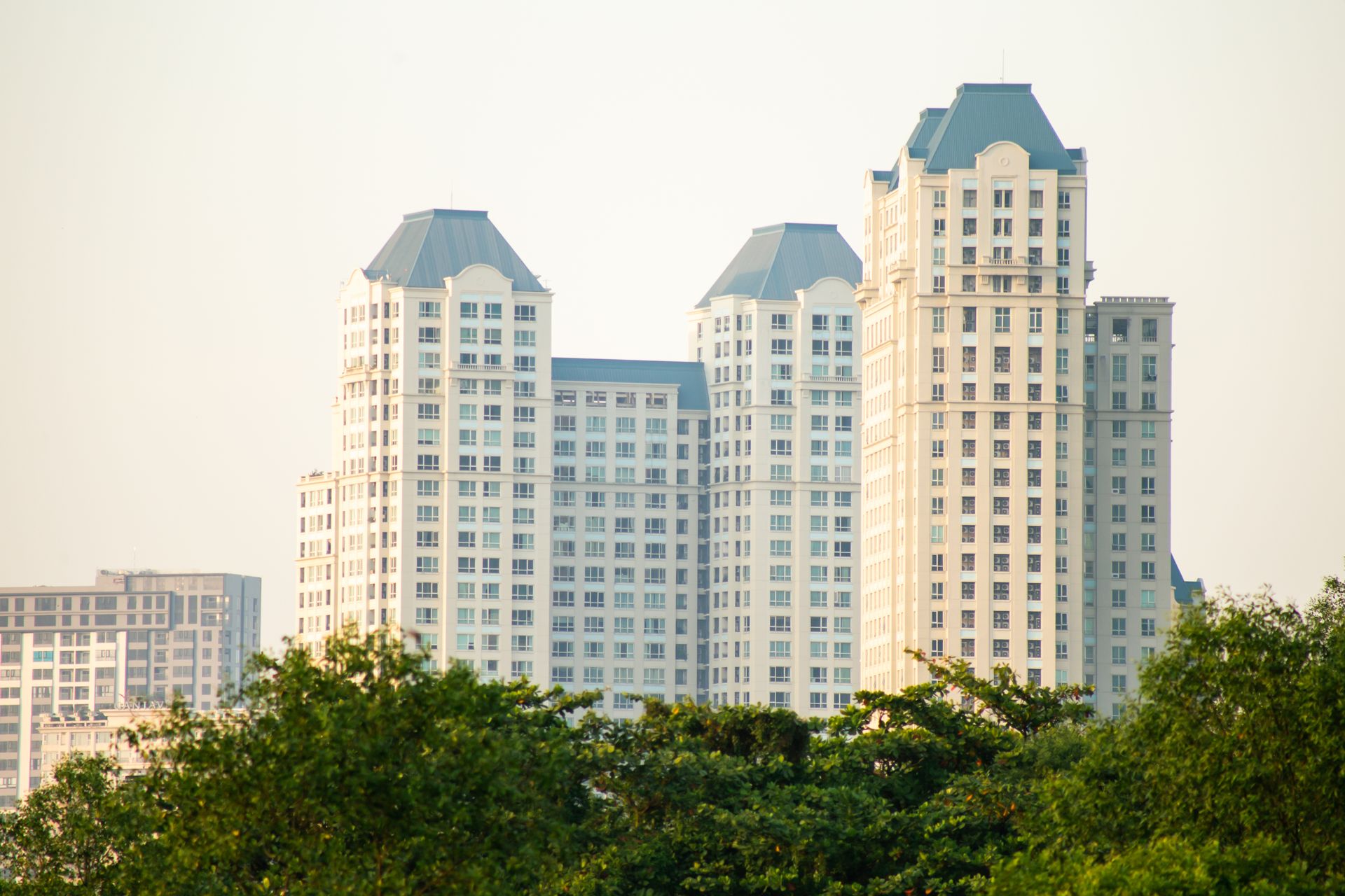 High-rise apartment towers surrounded by greenery in Ho Chi Minh City