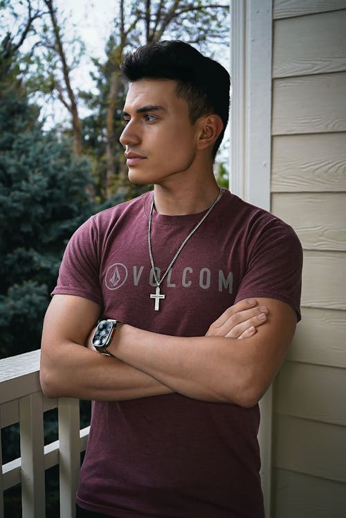 Man Posing in T-shirt and with Necklace