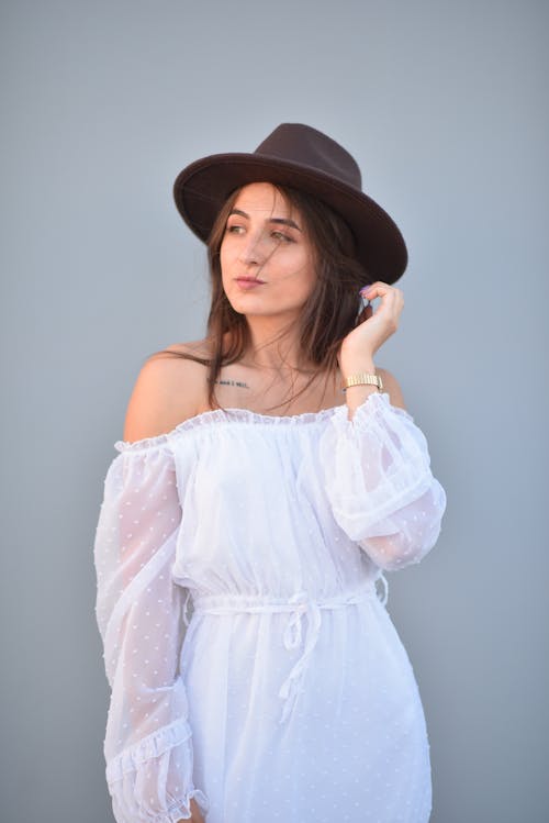 Woman in Hat and White Dress