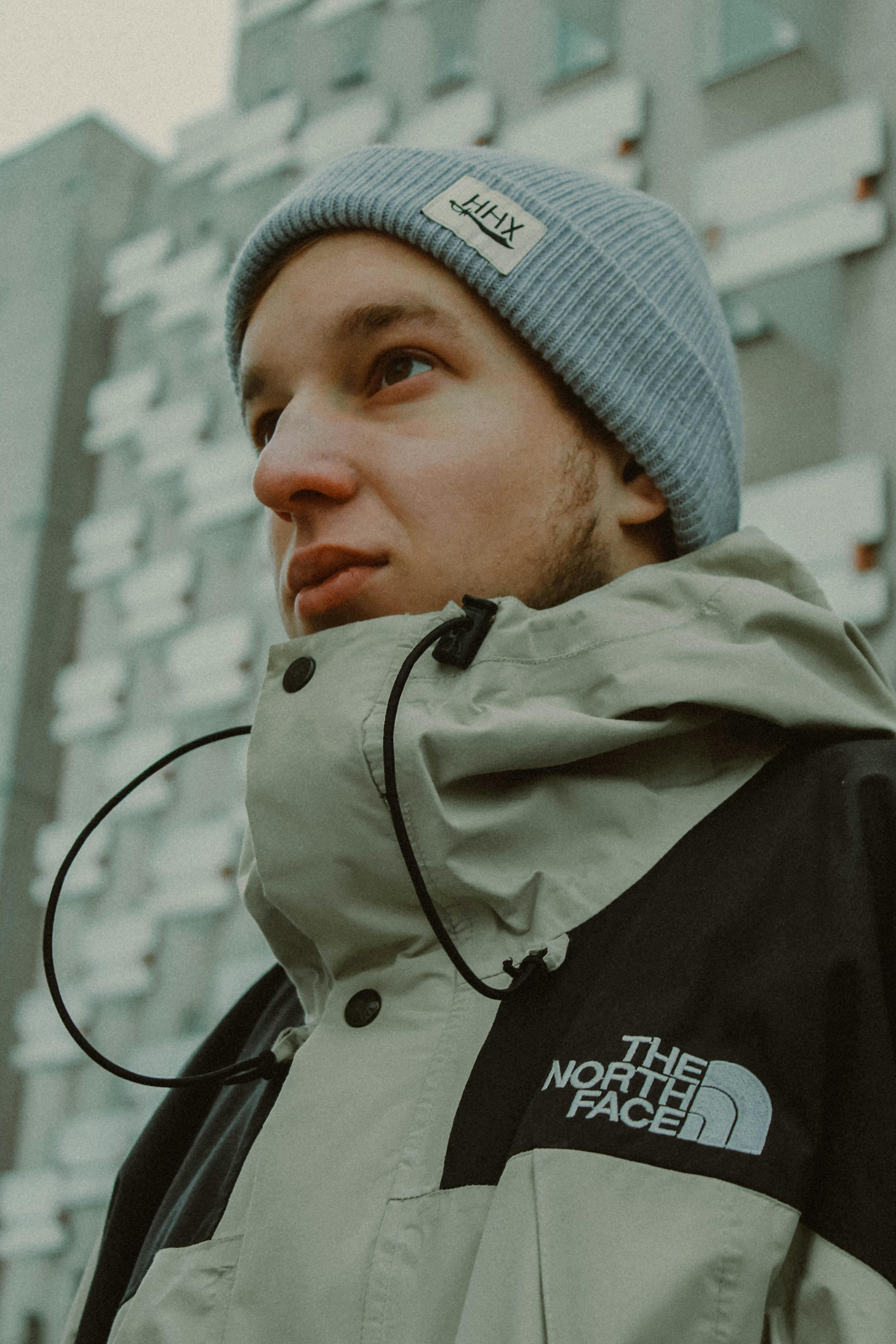 Close-up of a man in winter clothing, showcasing urban fashion style.
