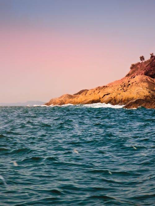 Clear Sky over Rocks on Sea Shore