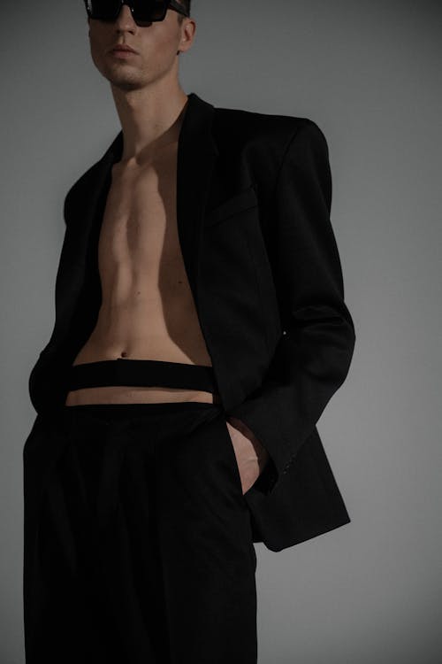 Shirtless Man in a Black Suit 
