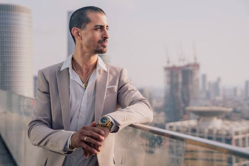 Man Posing in Suit in City