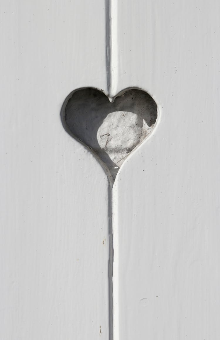 White Wooden Door With Heart Shape While Looking The Stars