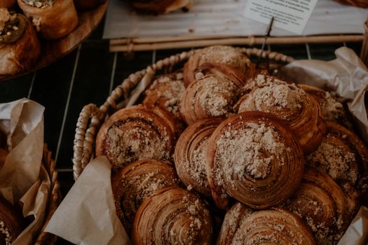 A close-up of freshly baked pastries in a basket, showcasing the delicious texture and warmth.