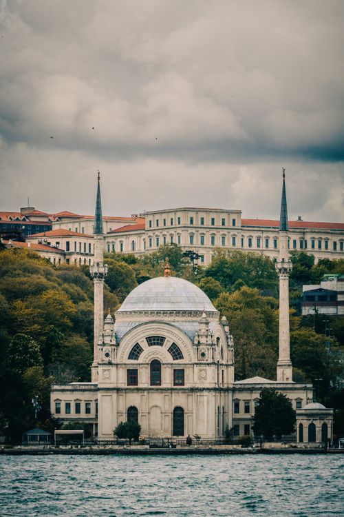 Free View of the historic Dolmabahçe Mosque by the Bosphorus in overcast weather, Istanbul. Stock Photo