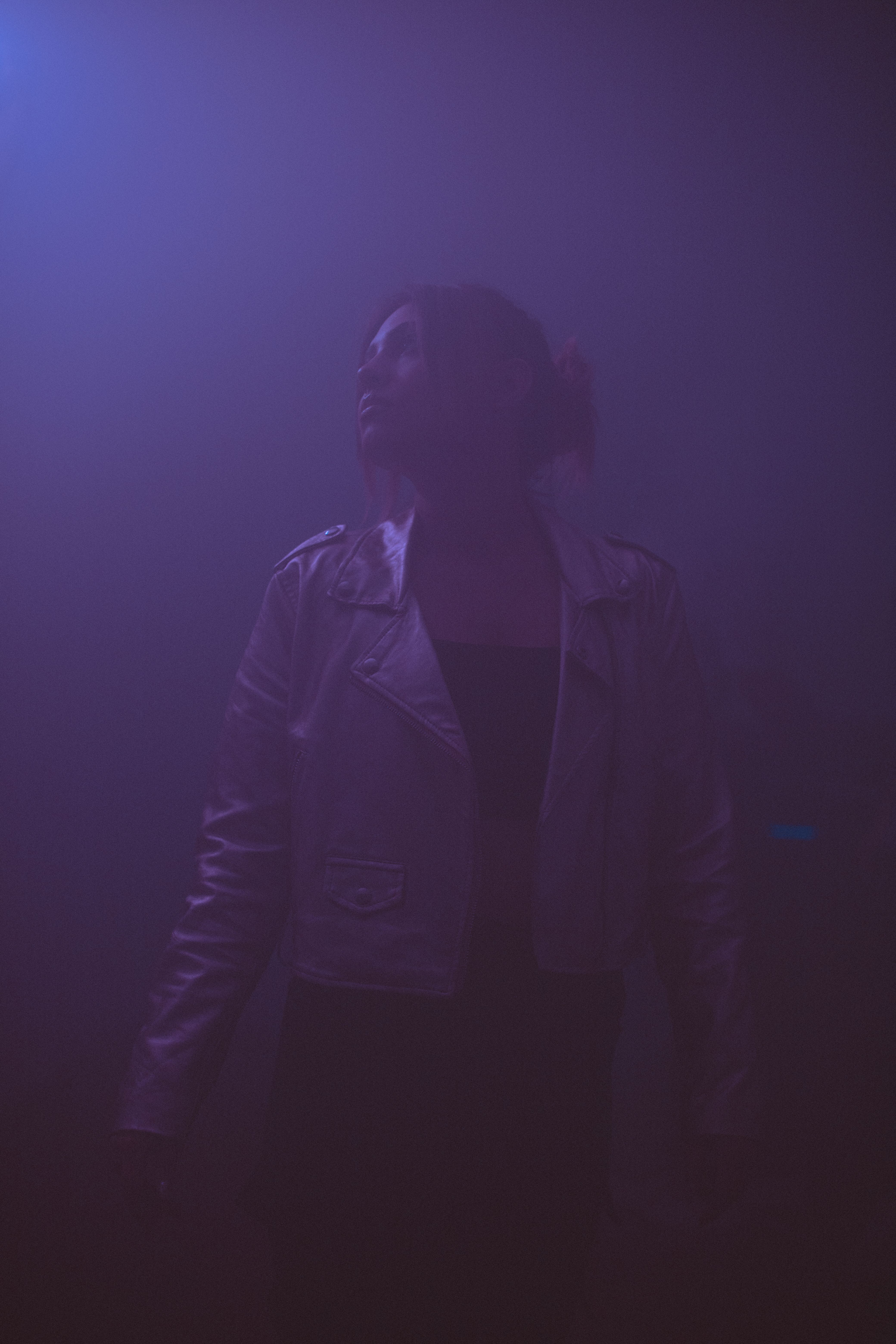 Woman in Jacket Posing in Darkness · Free Stock Photo