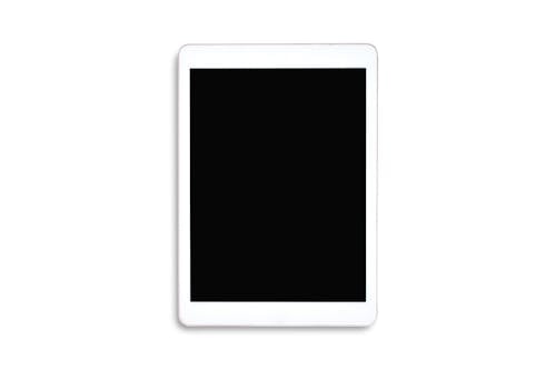 Clipping path. Top view to white tablet computer isolated and Empty(Blank) black screen on white background view. Flat lay  of Tablet isolated. Mockup.