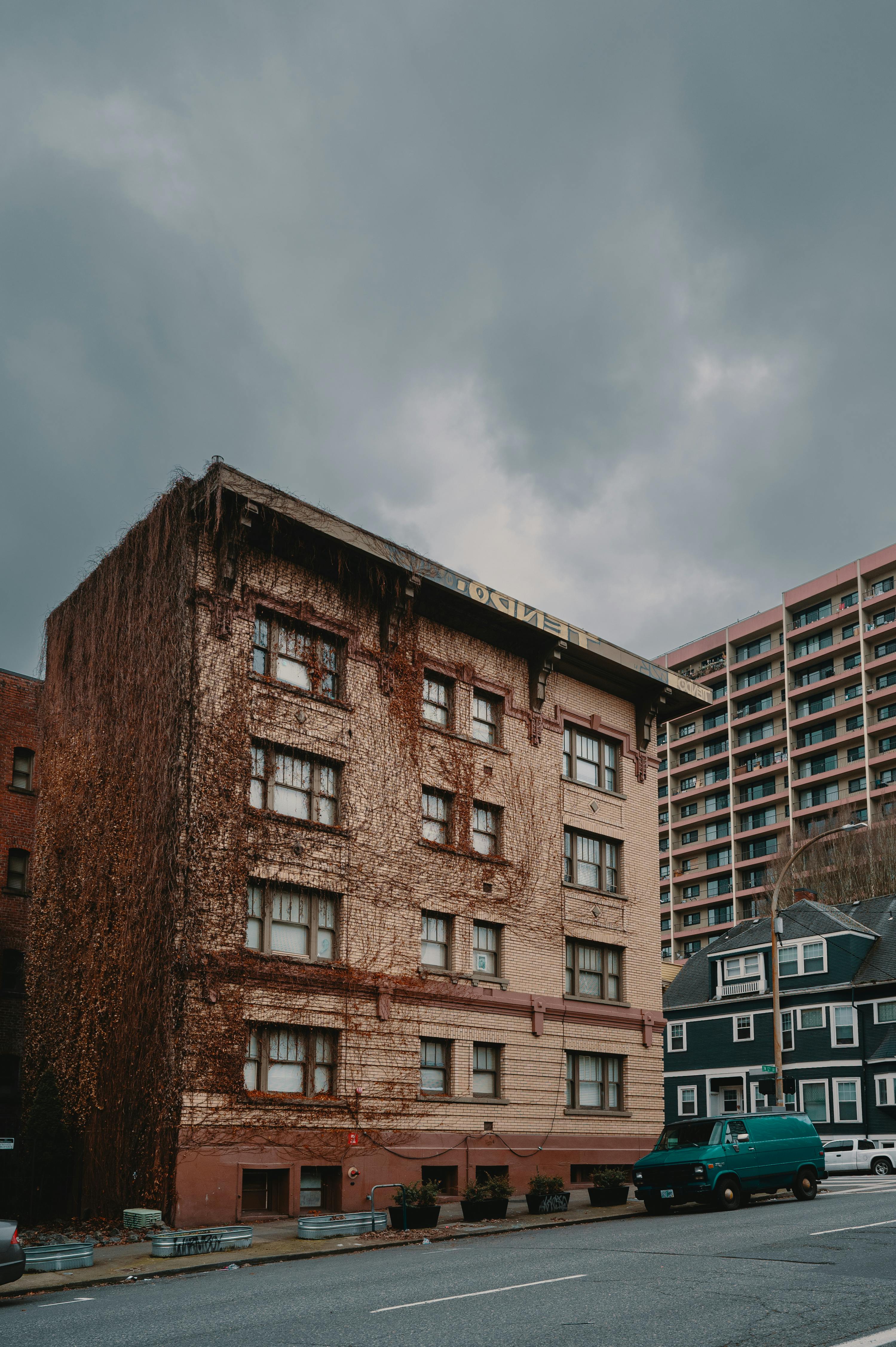 Urban scene of an ivy-covered apartment building on an overcast day in Portland, Oregon.