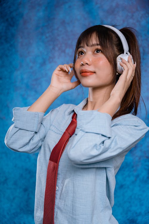 Portrait of a Pretty Brunette Wearing Headphones