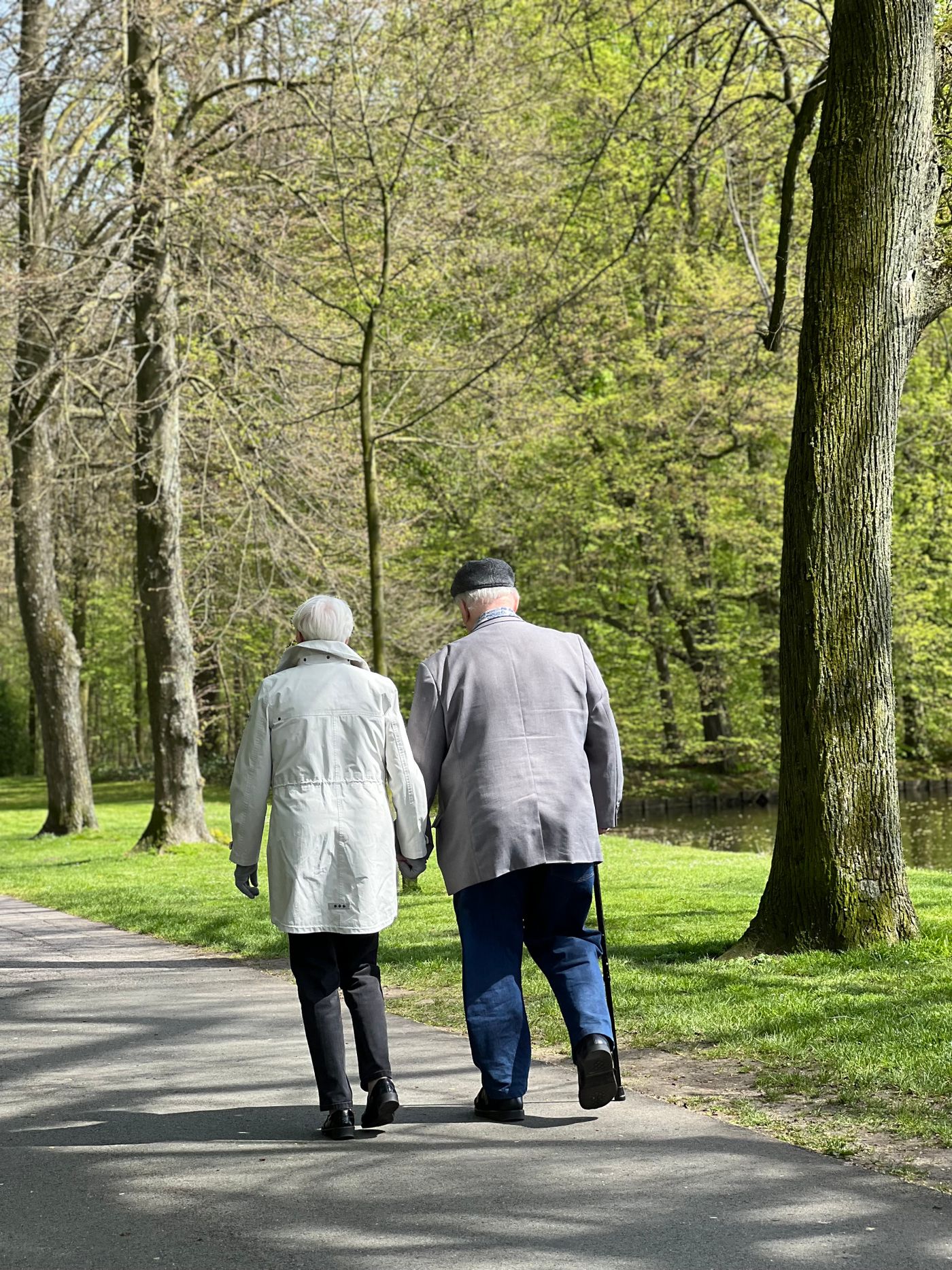 Elderly couple enjoying a walk together in the park