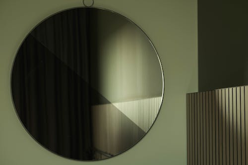 Large Round Mirror Hanging on a Wall