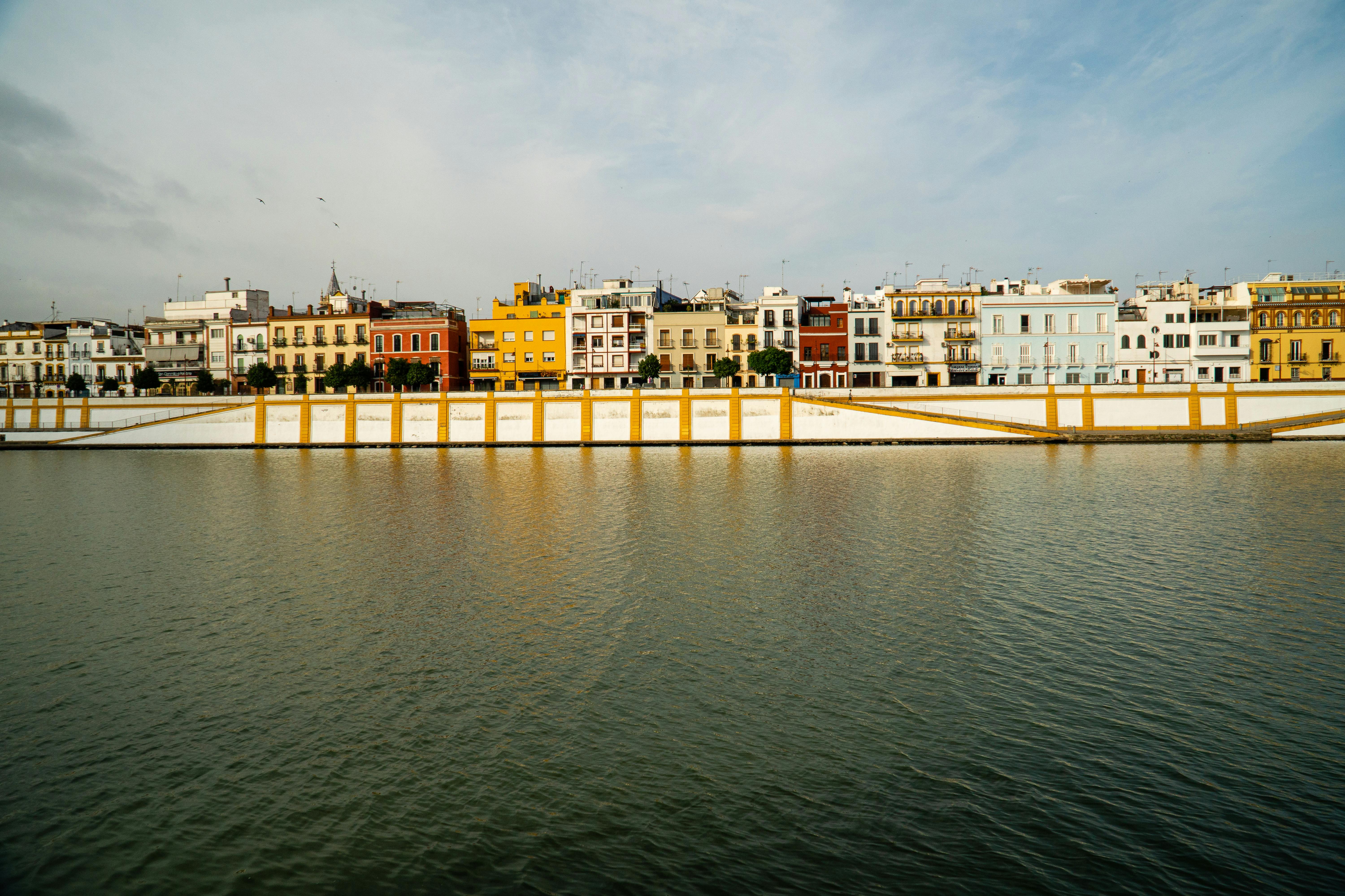 Waterfront View of Houses in Seville, Spain · Free Stock Photo