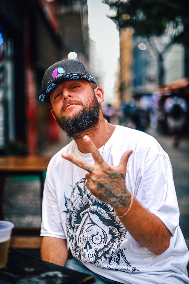 Man In Cap And With Tattoo