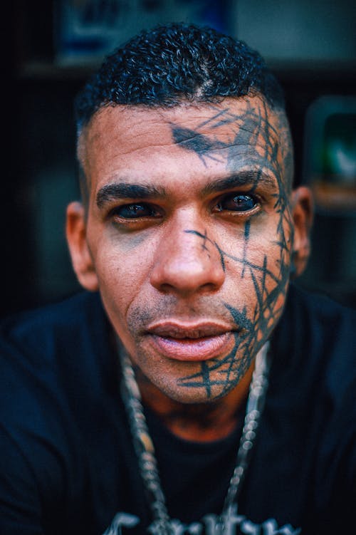 Tattoos on Man Face