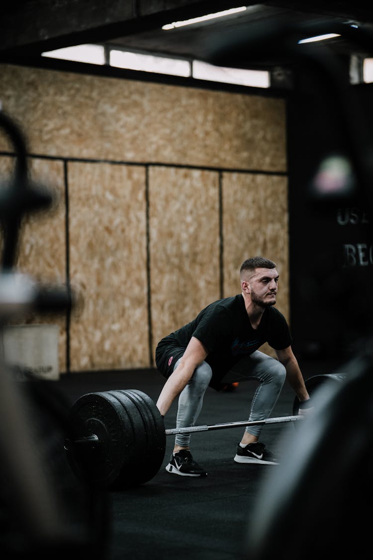 Man Lifting Weights In A Gym 