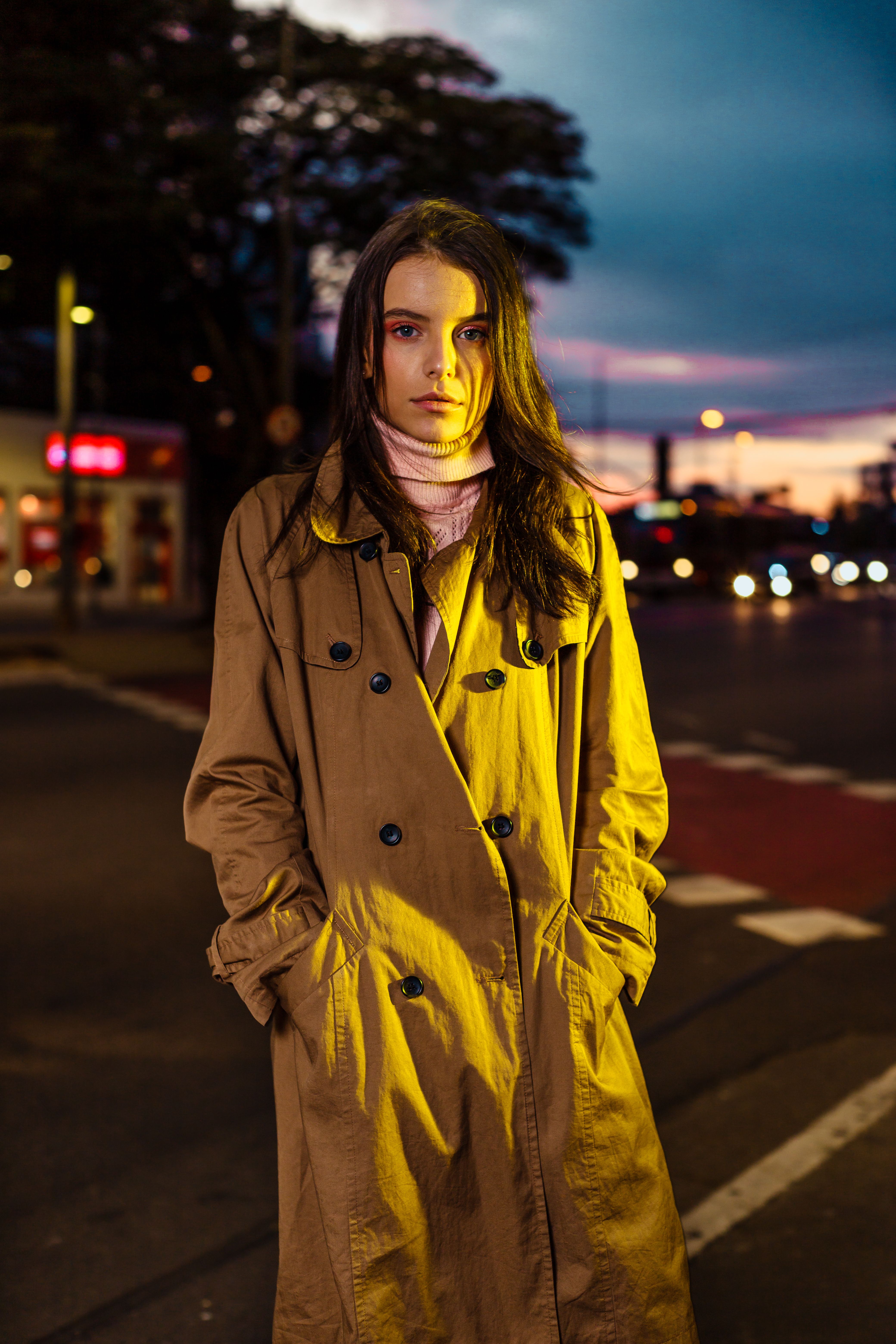 Woman in a Trench Coat Standing in the City Street · Free Stock Photo