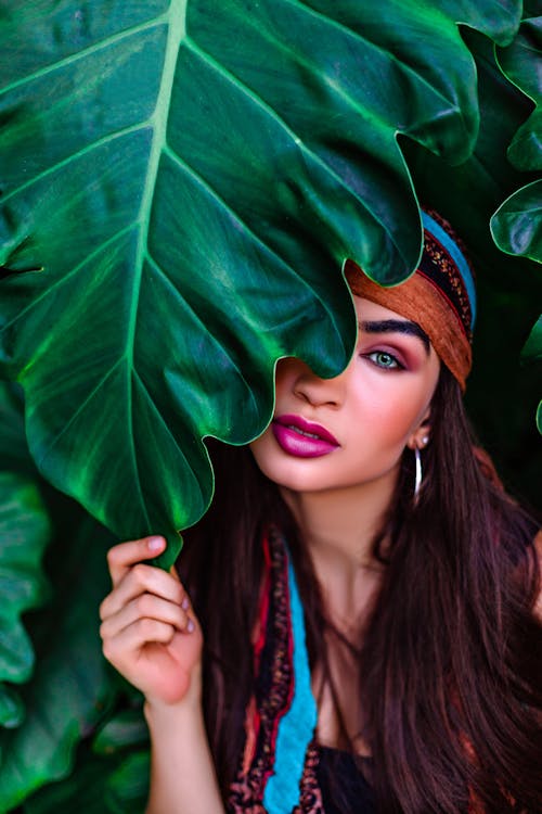 Woman Posing and Holding Leaf