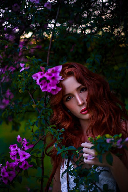 Portrait of a Young Woman Among Purple Flowers 