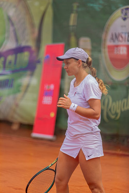 Woman with Racket Playing Tennis