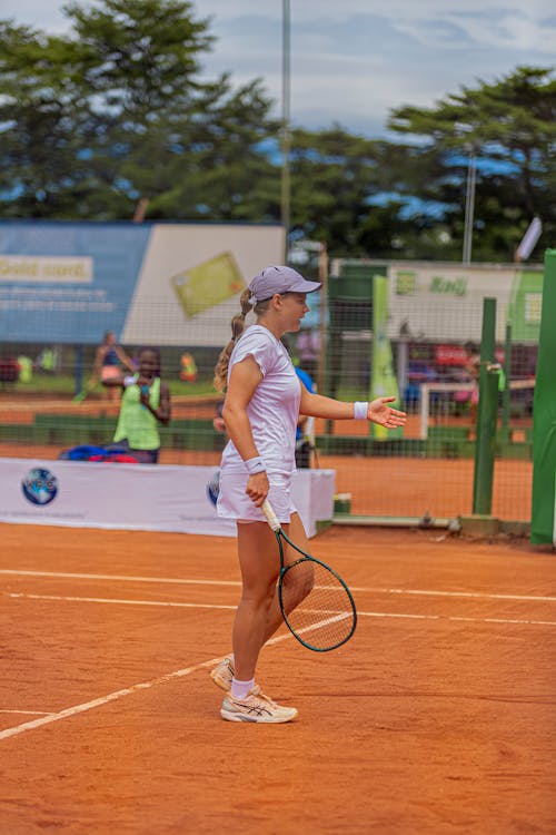 Woman with Racket Playing Tennis