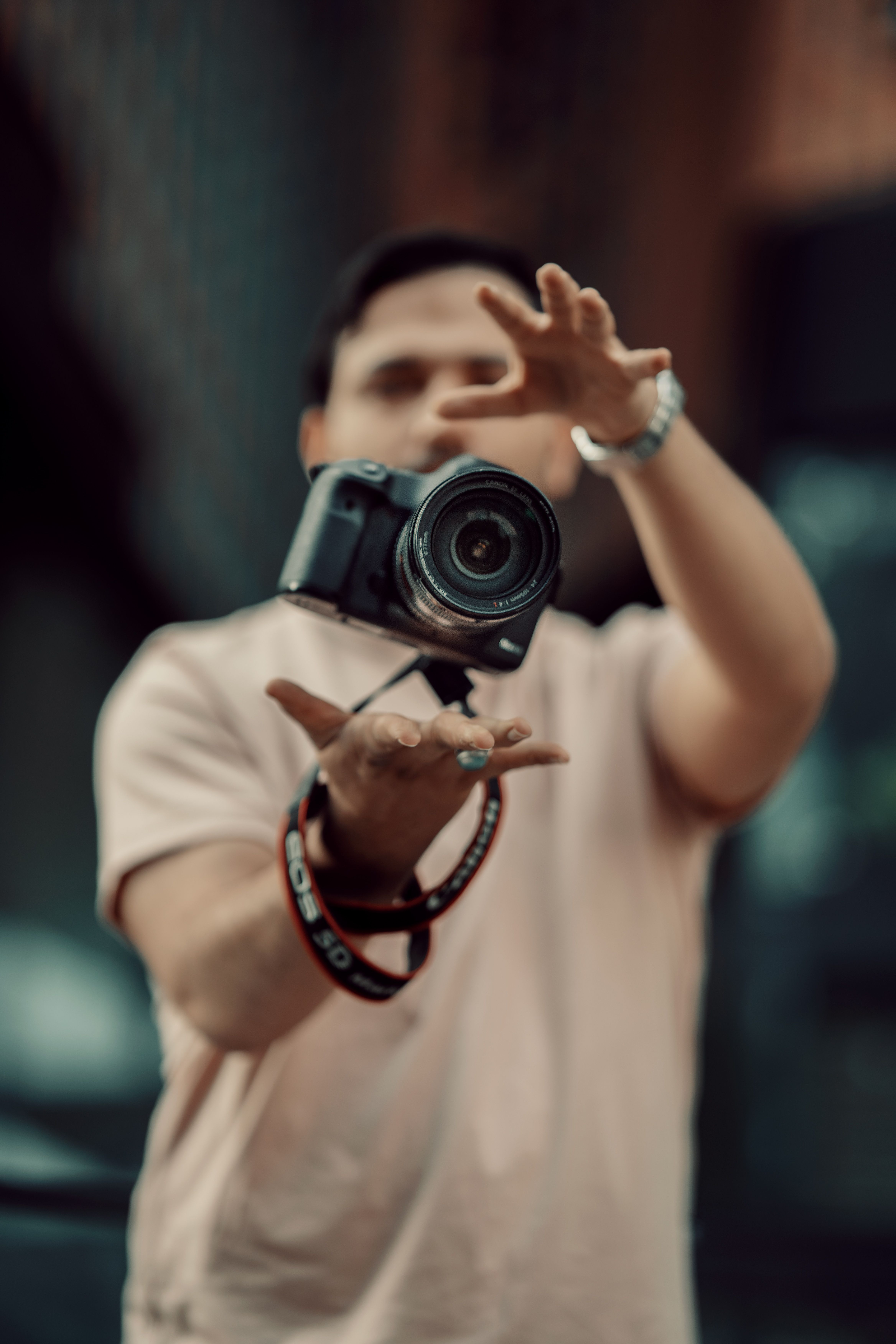 Man Hands Catching Flying Camera · Free Stock Photo