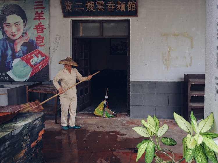 Woman Sweeping The Floor 